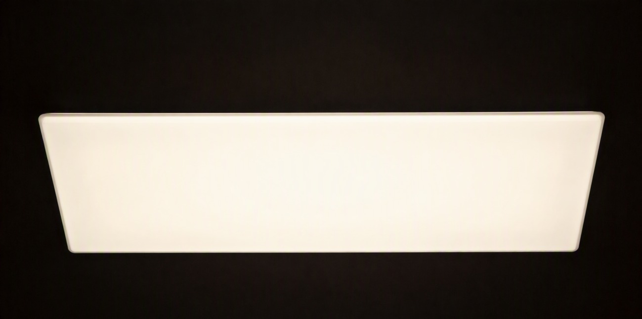 A glowing diffuser plate spreading light evenly from hidden points behind it.