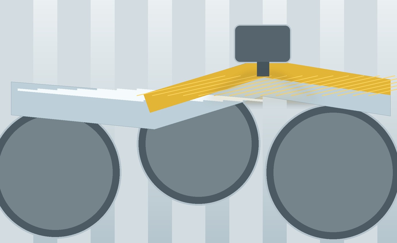 Metallic foil moving through rollers while a thin transparent treatment layer forms across its surface.