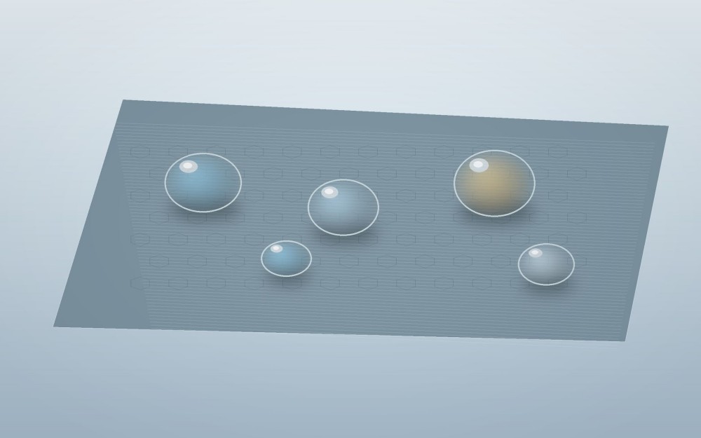 Rounded water and oil droplets sit above a coated metallic microtexture with minimal spreading.