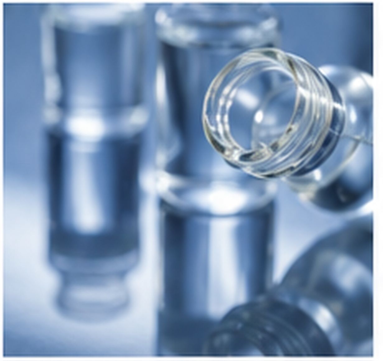 Open glass bottle containing a clear organosilicon liquid against a clean blue technical background.