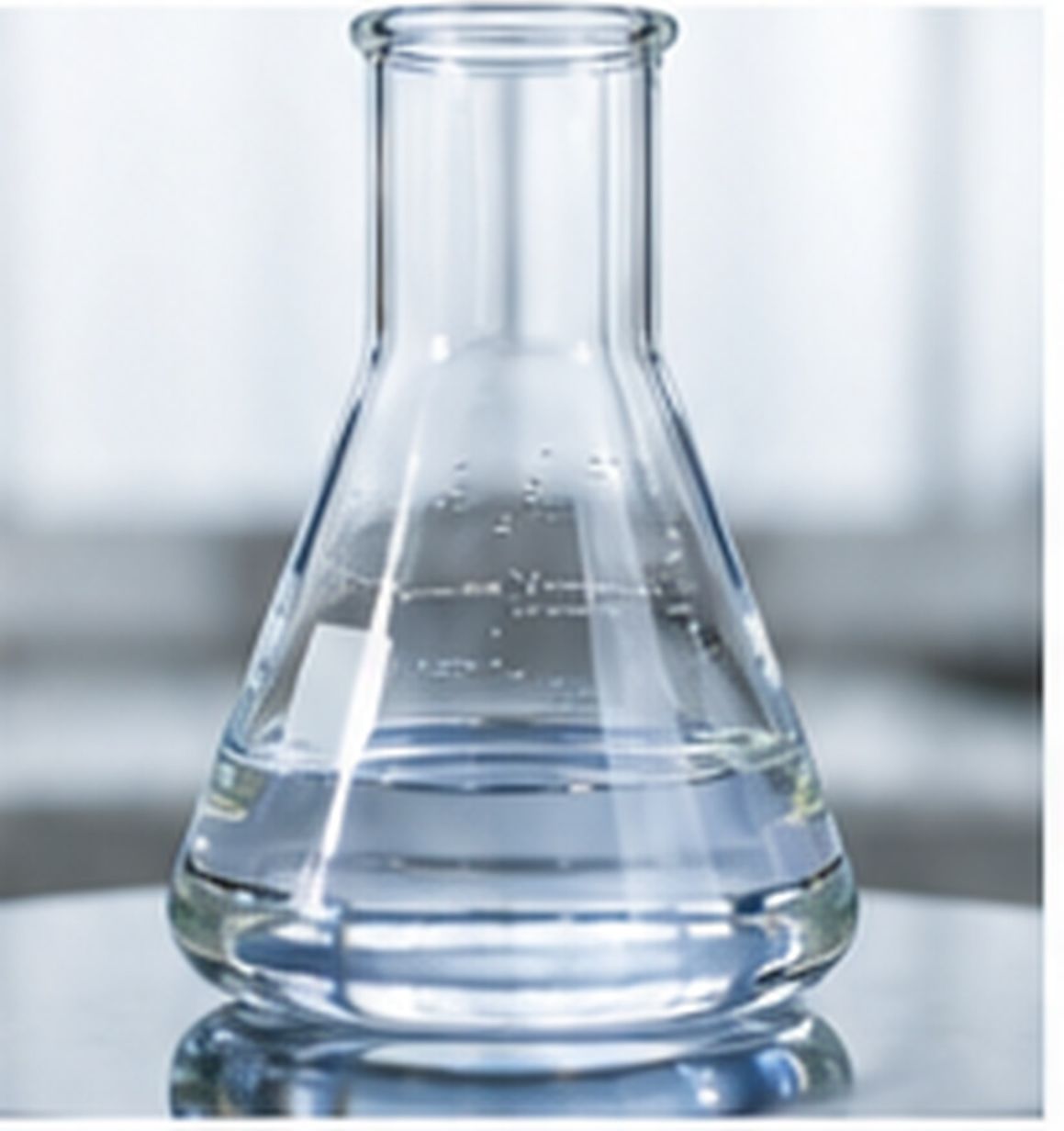 Laboratory flask containing a transparent functional silicone liquid for formulation evaluation.