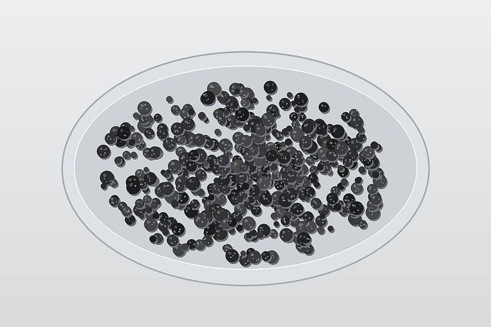 Engineered black silicon–carbon composite powder represented as dense secondary particles for battery-anode material development.