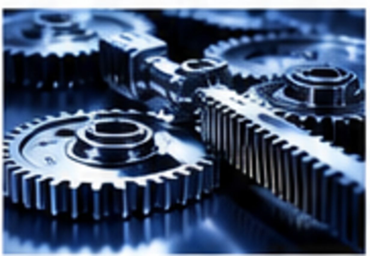 Close-up of precision metal gears with a thin transparent silicone-fluid film between moving surfaces.
