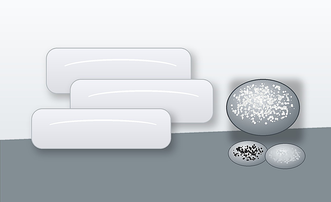 High-consistency silicone gum slabs with reinforcing filler and compounding ingredients arranged on an industrial work surface.