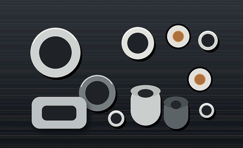 Molded silicone seals, rings and insulating sleeves arranged with ceramic and metal electrical components.