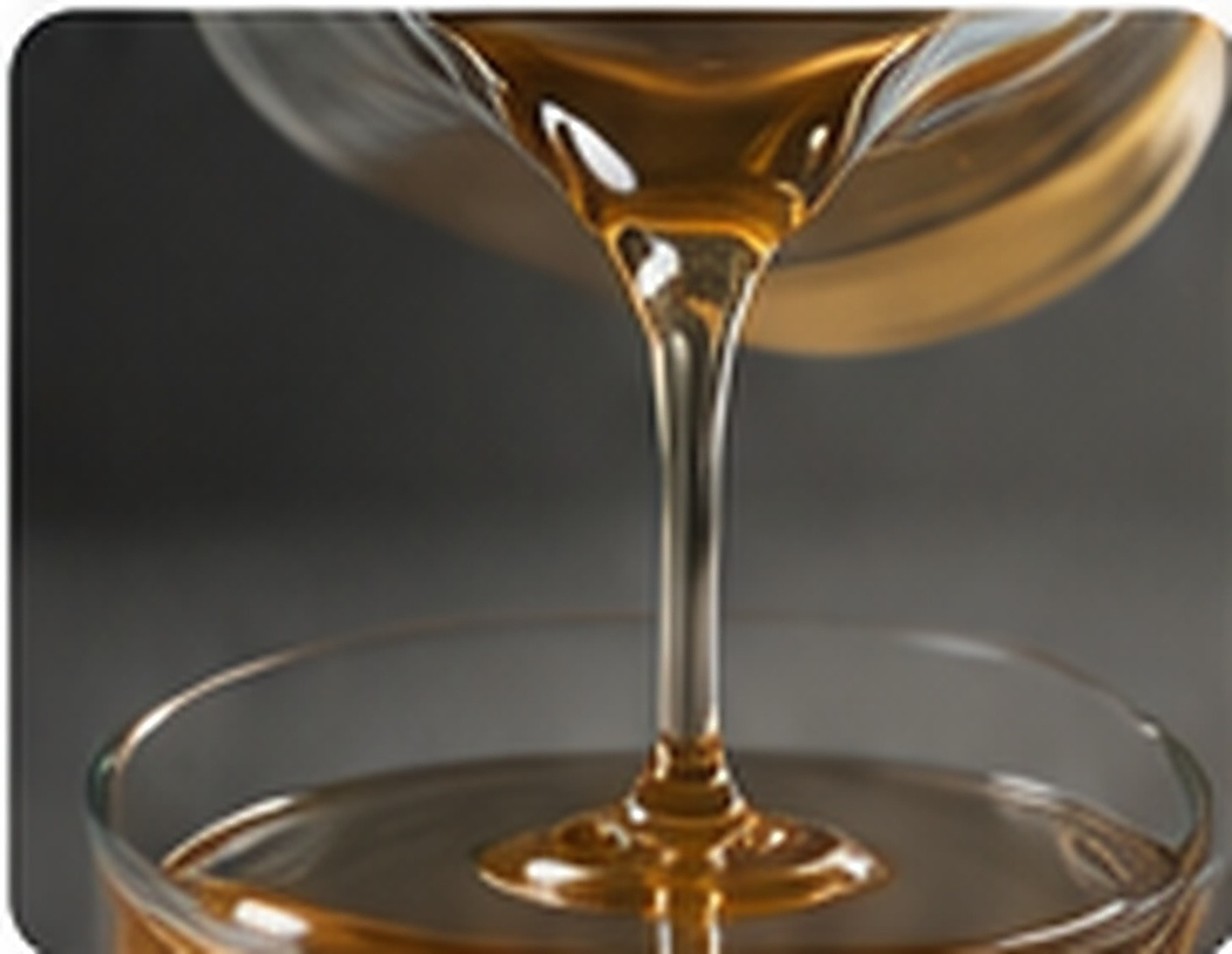 Pale amber liquid vinyl silicone resin with a high-viscosity flow profile for reactive silicone formulations.