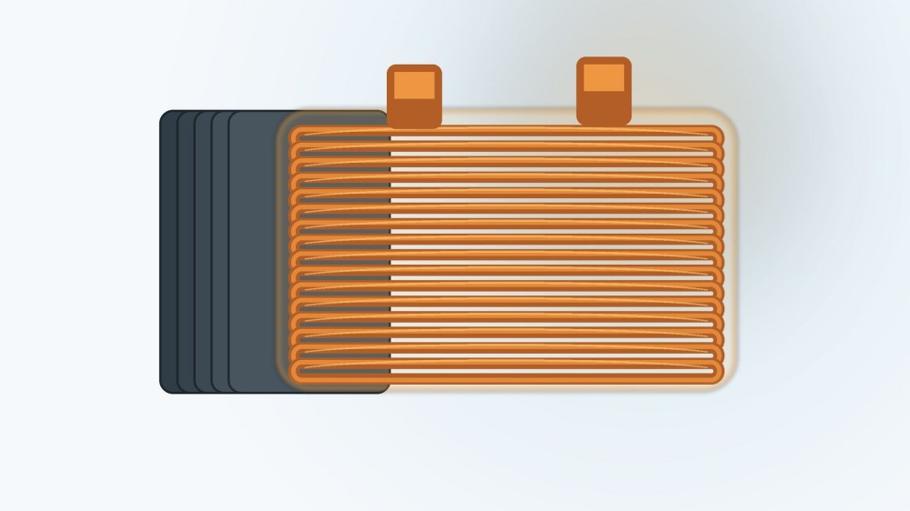 Copper electrical coil wrapped around a laminated core with a conceptual insulating resin layer.