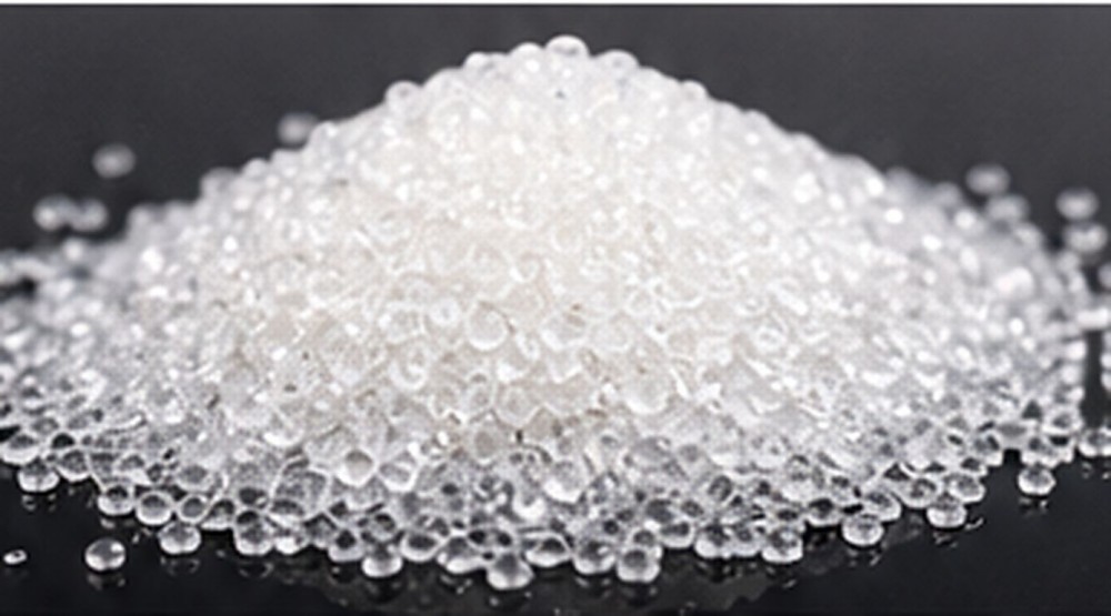 Translucent silicone resin granules arranged as a dry raw-material sample.