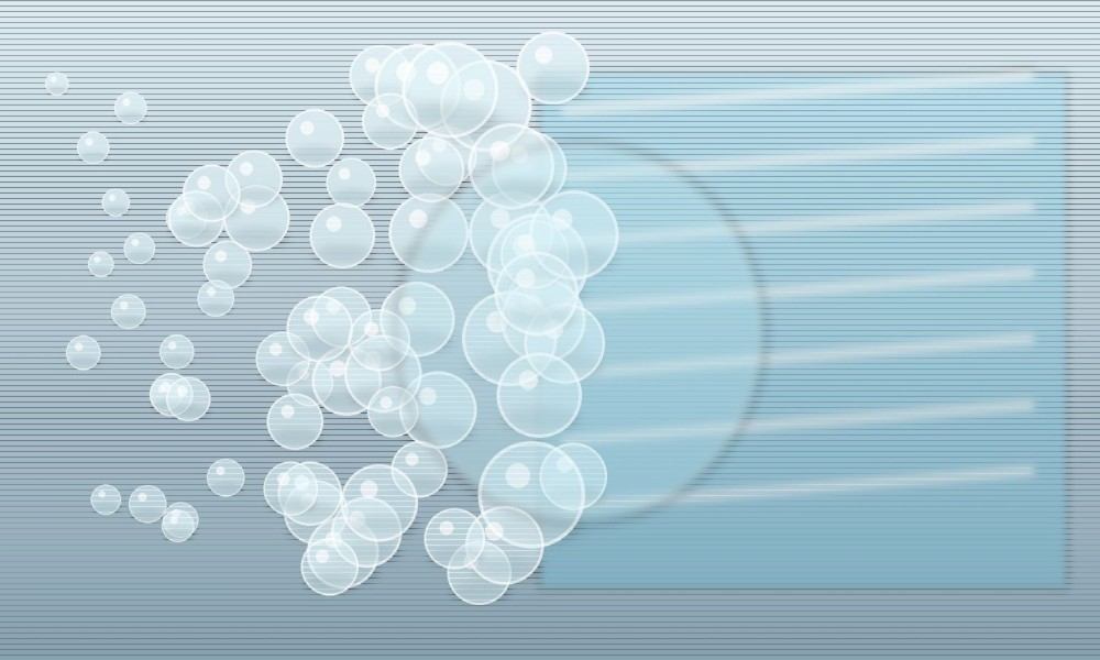 Milky silicone-emulsion droplets transition across a technical surface into a smooth continuous transparent film.