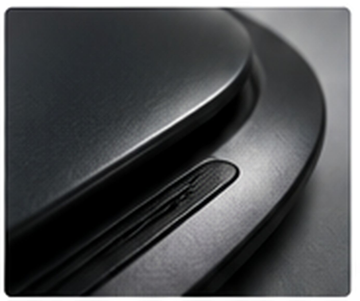 Close-up of a dark industrial polymer surface with an even tactile microtexture.