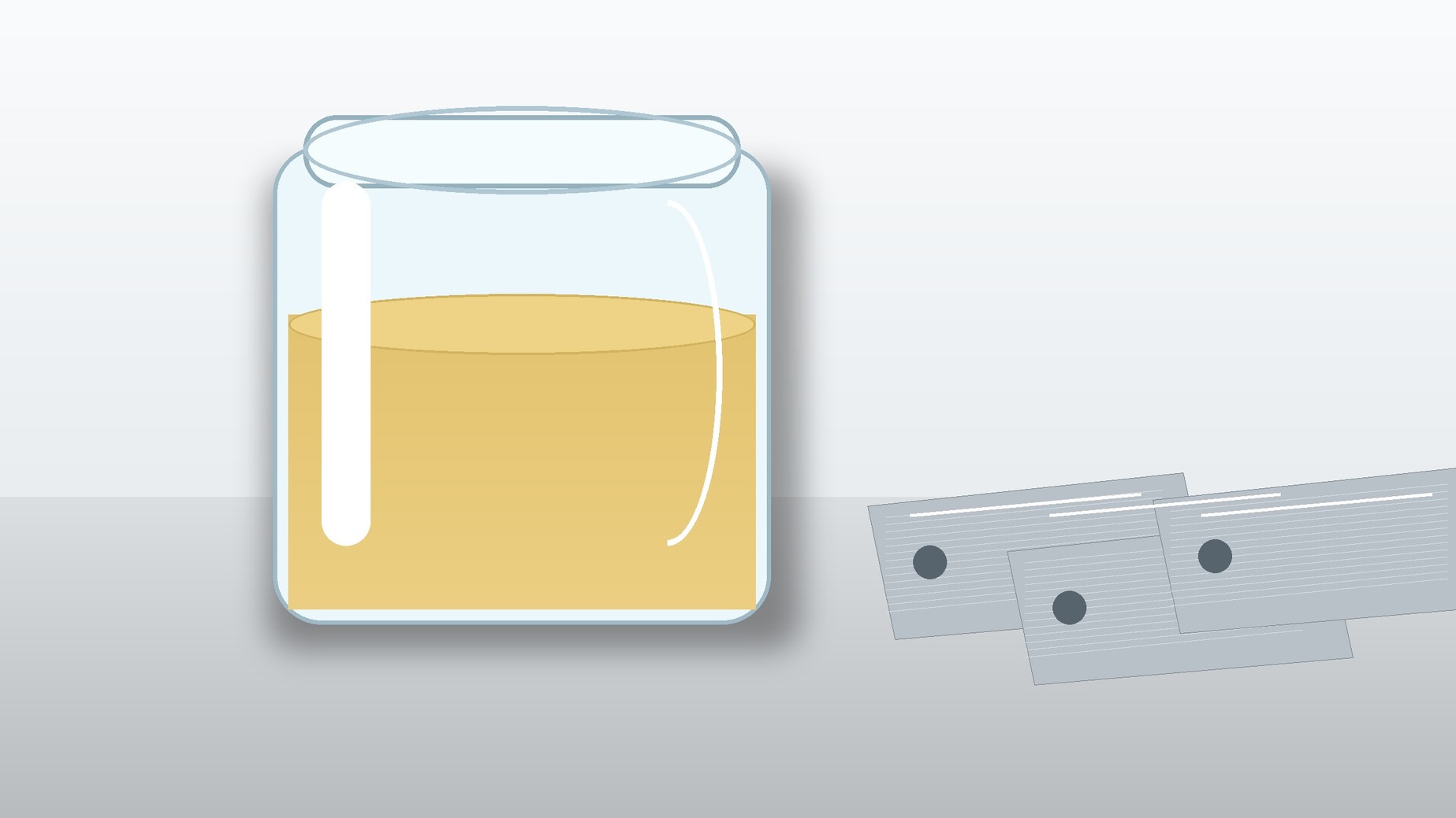 Pale-yellow silicone release fluid beside clean metal test panels in an industrial laboratory.