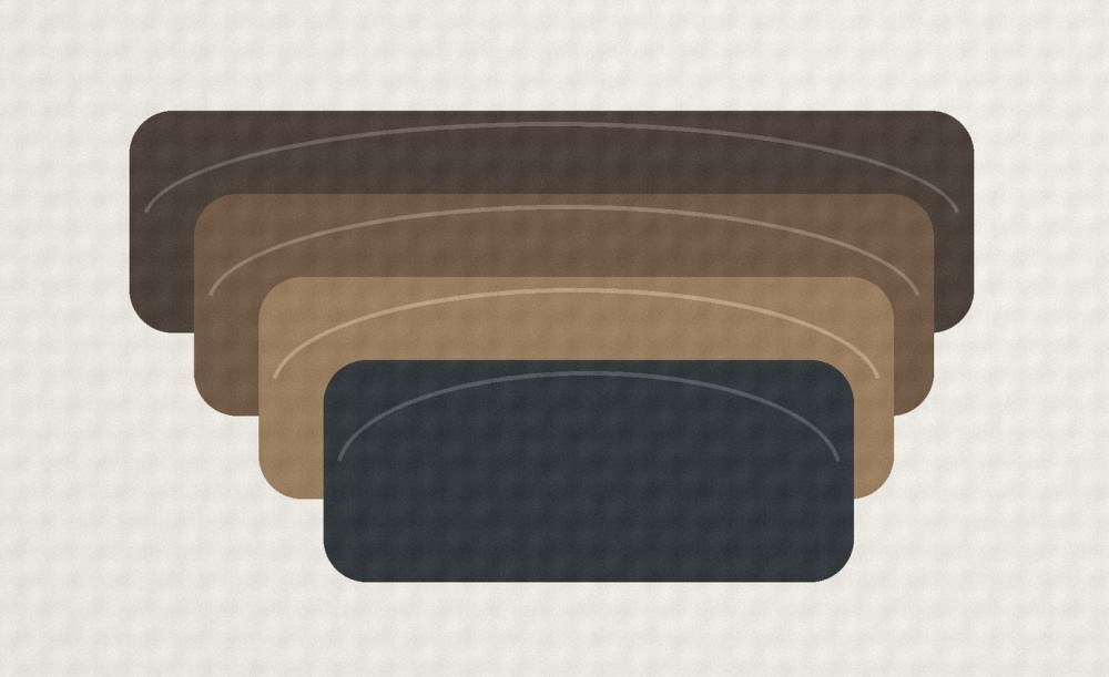 Layered synthetic leather swatches showing fine grain and a smooth soft-touch finish.