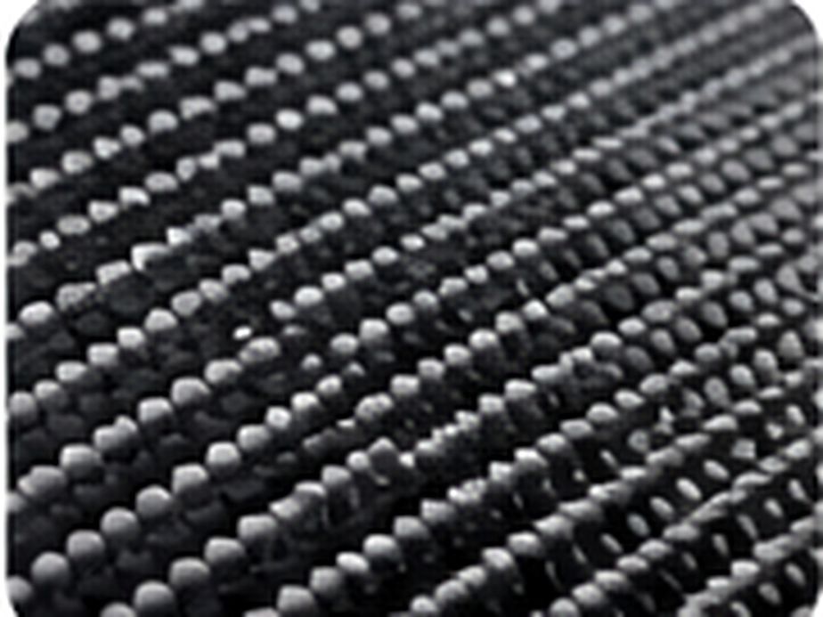 Macro patterned technical textile showing a dense repeating surface built for high-contact applications.