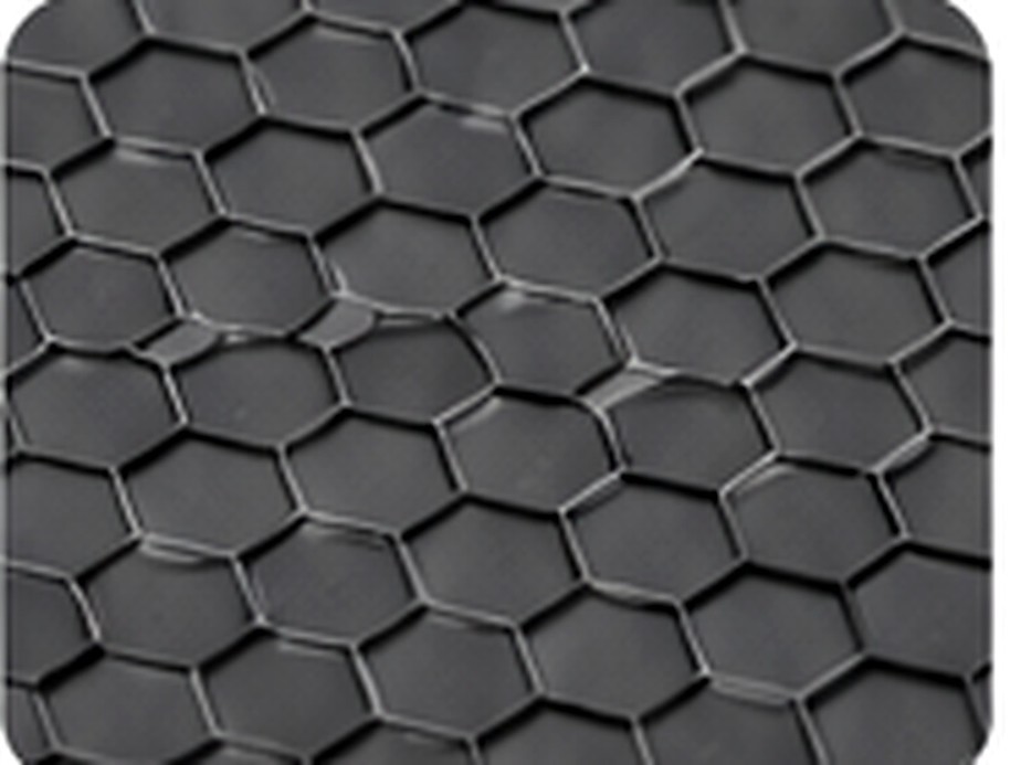 Close-up of a hexagonal engineered texture symbolizing a durable abrasion-resistant outer layer.